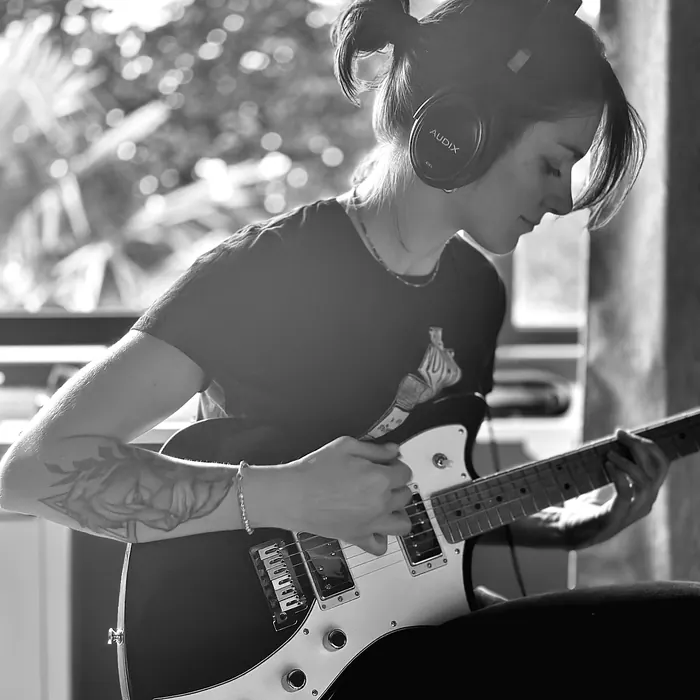 Guitarist tracking by the window